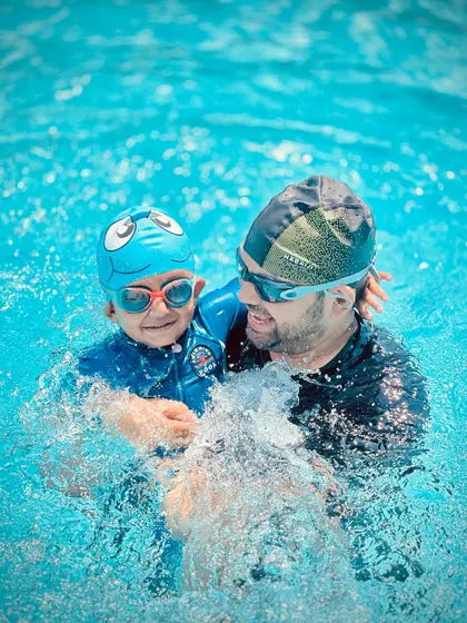 A coach and student working together. These photos show the fun and supportive one-on-one moments that happen even in our group classes.