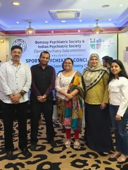 A group photo with fellow panelists and organizers at the Sports Psychiatry Conclave.