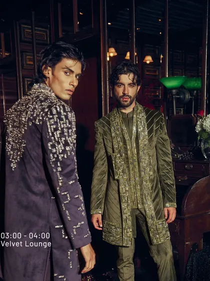 This image showcases the versatility of my velvet collection. On the left, a deep wine jacket with cascading silver embroidery. On the right, an olive green ensemble with coordinated, shimmering detail. Both are designed to make an impact in any evening setting.