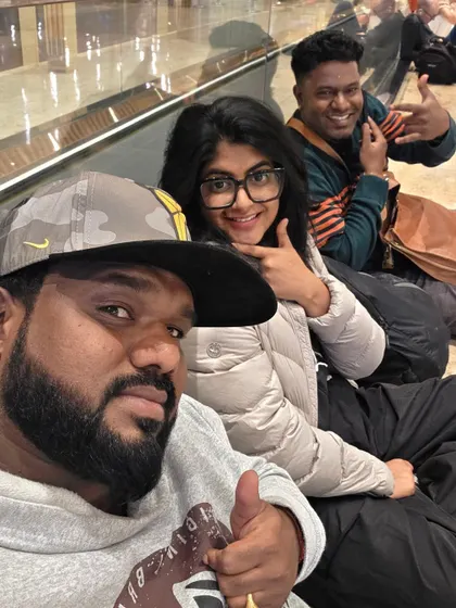 Chilling at the airport with my bandmates during our America tour. The journey is just as memorable as the destination.