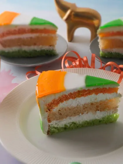 Our Republic Day Tiranga Pastry is a single serving of patriotic sweetness. It features layers of orange, white, and green sponge with cream, perfect for individual enjoyment.