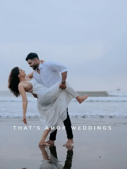 A dynamic pose on the beach, with the ocean in the background. This shot combines classic romance with a sense of movement and style.