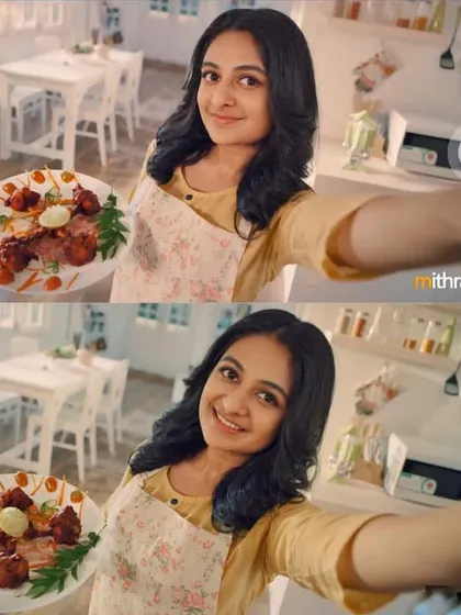 A print ad still for a cooking oil brand, featuring a bright and clean kitchen setting. The makeup is fresh and natural, perfect for a lifestyle shoot.