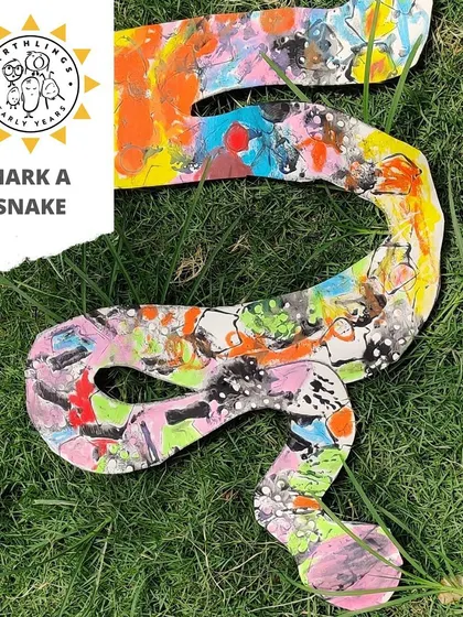 Sssss-so much fun! We use stamping, coloring, and cutting to create these vibrant snakes. This process art project allows for endless creativity with patterns and colors, inspired by our jungle theme.