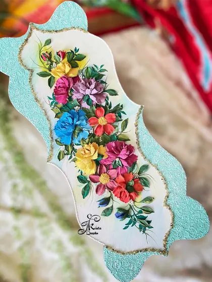 This uniquely shaped wall panel is designed to be a vertical accent piece. I filled the center with a cascade of my signature multi-colored flowers, creating a vibrant splash of color against the neutral background.