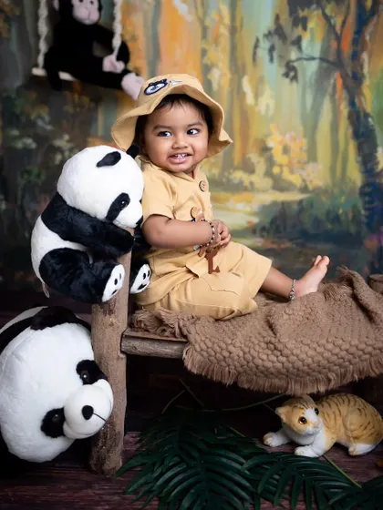 A sweet, curious glance from the little one during his jungle-themed sitter photoshoot.