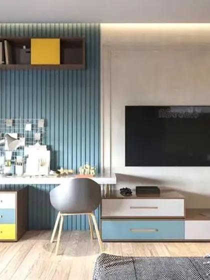 A colorful and functional study wall that includes a desk, TV mount, and plenty of shelving. This design shows how to combine work, entertainment, and storage in one area.