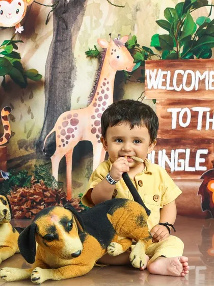 This little adventurer is taking a moment to chew on a stick, just like a real explorer. It's these candid moments that make the best memories.