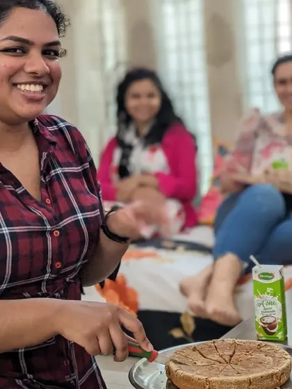A participant cutting a cake at our journaling session. We often celebrate small moments and make our gatherings feel like a get-together with close friends.