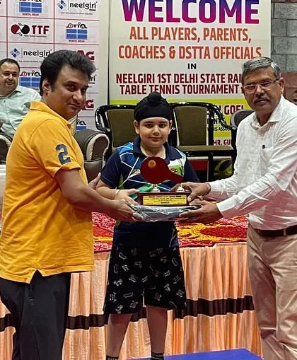 And this is the result of that focus. Here is my 8-year-old player, Mehransh Singh Bhatia, proudly receiving his silver medal at the 1st Delhi State Ranking Tournament. Hard work always pays off.