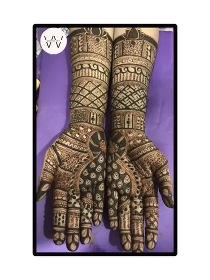 The front-hand design for the same client, featuring beautiful peacocks and intricate arm work.