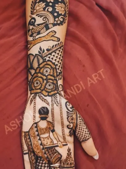 A graceful design created for the Teej festival, featuring a woman on a swing. The arm is adorned with rose motifs and a bird on a branch, combining figurative work with natural elements.