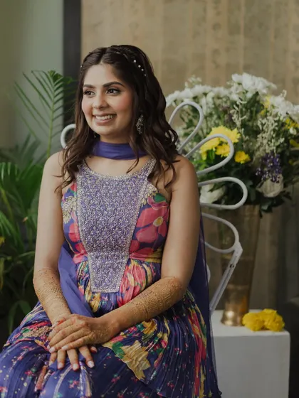 A fresh and fun look for her Mehendi. The colorful outfit is the star, so we kept the makeup simple and glowing with a braided hairstyle.