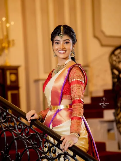 The elegance of a Kanjivaram saree on a grand staircase. Amrutha Prem looks absolutely timeless in this setting.