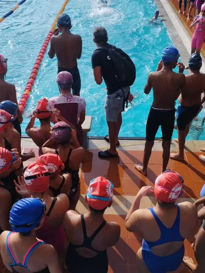 Listening intently before a race. These pre-race briefings are crucial for reinforcing strategy and building confidence.