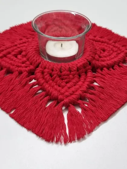 This holder is designed to perfectly cradle a standard glass votive or a traditional diya.