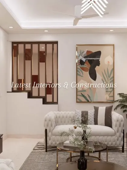 This view reveals a cozy corner of the living room, featuring a unique wooden partition that adds visual interest and separates the space without closing it off. The abstract artwork brings a contemporary touch to the classic wall moldings.
