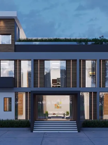An office building designed with a clean, modern aesthetic, featuring large windows for ample natural light. A rooftop terrace with greenery provides an outdoor space for employees.