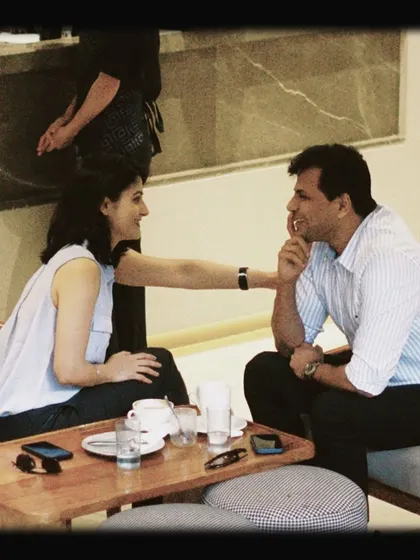 A couple enjoying an intimate conversation at their table. We provide the space for connections to happen.
