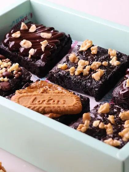 Our assorted brownie box is a classic Rakhi gift. It includes a selection of our best selling fudgy brownies, from classic walnut to indulgent Lotus Biscoff.