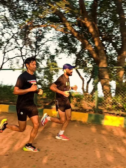 A close up shot of runners during an endurance workout, showing focus and good form even deep into the run.