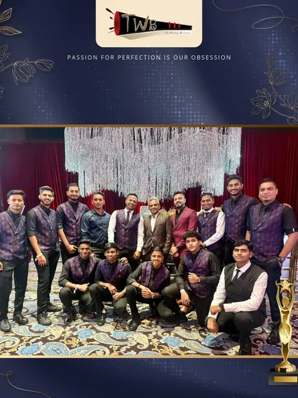 Our large, professional team posing together at an awards ceremony, showcasing the scale and pride of our company.