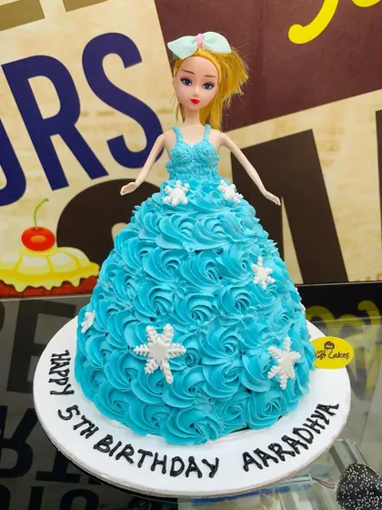 A 1.5kg Barbie doll cake with a beautiful blue rosette dress.