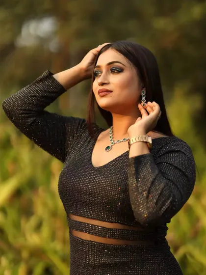 A dramatic outdoor photoshoot look featuring a dark, smokey eye and a nude lip. This bold eye makeup makes a statement and is perfect for fashion-forward shoots.