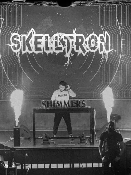 A black and white shot of the Shimmers stage, giving it a timeless, epic feel.