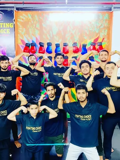 The team showing off their strength after a workout. We build strong bodies and even stronger bonds.