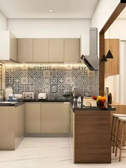 A U-shaped kitchen with a peninsula that doubles as a breakfast bar. The patterned backsplash adds a touch of traditional charm to the modern, neutral cabinets.
