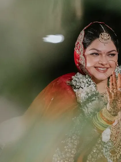 A bride's emotions are like the other side of the moon, beautiful yet hidden. This artistic shot captures Ridhi's smile and the depth of her feelings on her wedding day.