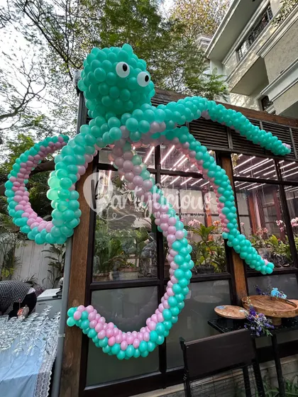 My balloon sculptures are where imagination truly runs wild. This giant, friendly octopus, crafted from hundreds of biodegradable balloons, became the star of an 'Under the Sea' adventure. It’s not just a decoration; it’s a piece of art that brings a theme to life and creates unforgettable photo moments for your little ones.