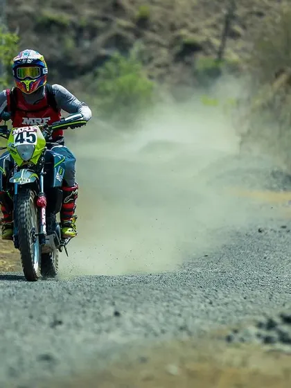 Kicking up dust on a loose gravel section of the rally. Bike control in low-traction situations is a critical skill we teach and a key part of our competitive advantage.