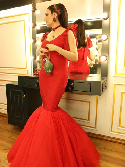 The full-length view of the dramatic red gown. The flared tulle bottom added so much movement and theatricality, perfect for the camera.