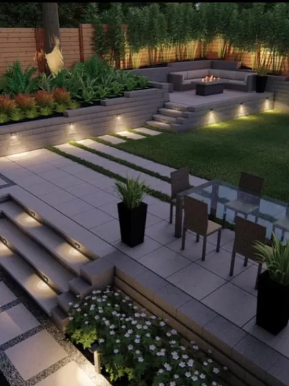 We design multi-level outdoor living areas that are both practical and stylish. This concept shows a combination of lawn, planters, and a paved patio with a dining area and a fire pit lounge, all connected by illuminated steps. It’s about creating different zones for relaxation and entertainment.