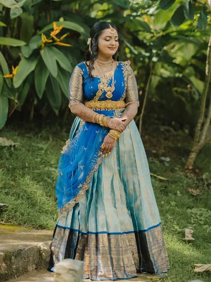 A stunning engagement look for a doctor couple in Mysore. The bride wore a beautiful blue half-saree, and we created a soft, glowing makeup look to complement it.