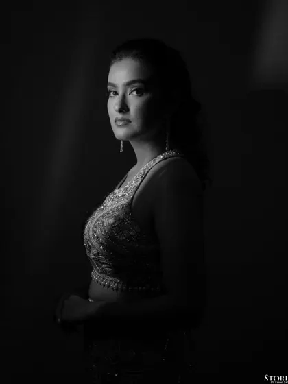 A dramatic black and white profile of the bride, her features beautifully sculpted by the light.