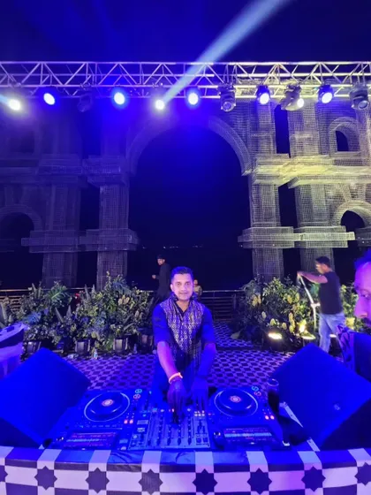 My setup for a sangeet with a stunning Roman-inspired backdrop. I ensure my console area looks clean and professional, fitting in with your event's decor.