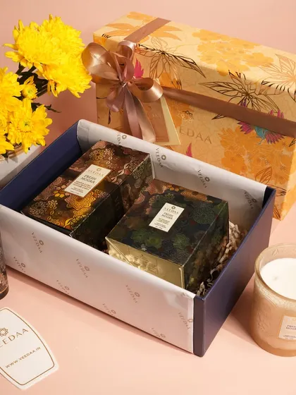 A bright and cheerful gift set, perfect for celebrating happy moments. The yellow floral box contains a curated selection of our products, including a room spray and a glass candle, making it a truly special present.