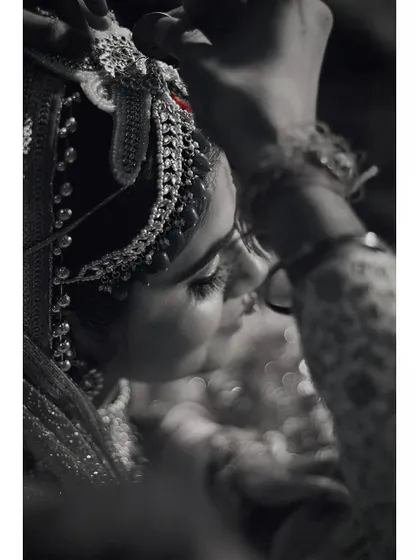The same moment, rendered in black and white to emphasize the emotion and timelessness of the ritual. This removes all distractions, focusing purely on the connection and the tradition.
