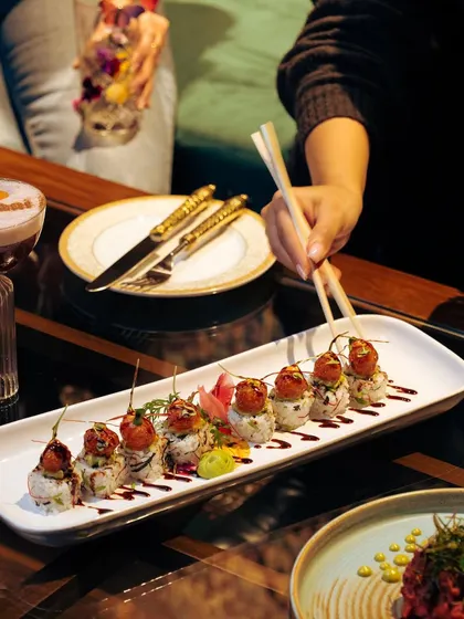 The delicate artistry of sushi. My chefs craft each roll with precision, ensuring every bite is a perfect blend of comfort and culinary excellence.