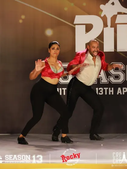 Theatricality and expression are key parts of our performance style. This shot captures a moment of drama and storytelling on the PIDC stage.