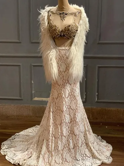 New in! This ivory lace lehenga with a stunningly embellished bustier and a faux fur shrug is a high-fashion, celebrity-style look.