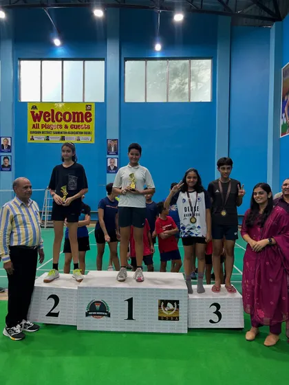 Anandita on the podium receiving her bronze medal in the U13 girls' singles category.