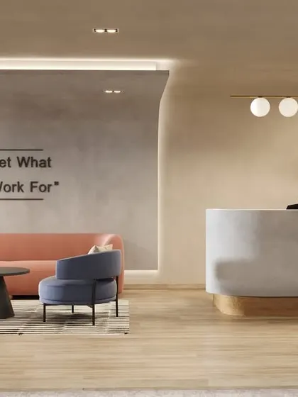This reception area design combines soft colors, comfortable seating, and an inspirational quote on the wall. It creates a calm, welcoming, and motivating atmosphere for both visitors and employees.