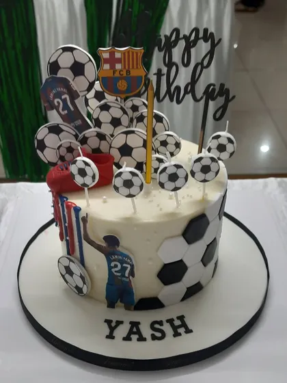 The awesome football-themed cake from Yash's party, proving you can have a big theme even in a compact space.