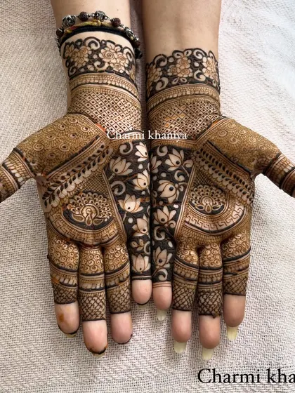 Just vibes! A beautiful, dense design featuring peacocks and lotuses, with a lovely floral vine separating the two hands.