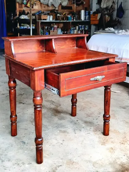 A traditional writing desk with turned legs and a hutch for organizing stationery, seen here in our workshop.
