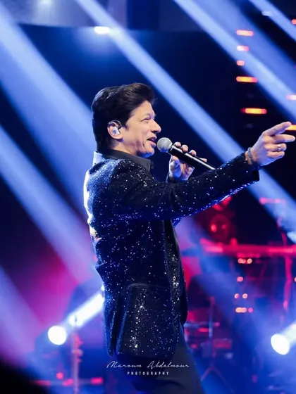 The legendary singer Shaan captivating the audience. I secure and coordinate with top artists to ensure your Sangeet night is an exclusive and unforgettable musical event.
